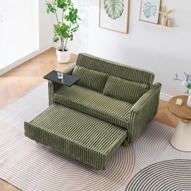 The pull-out and push-in green corduroy sofa with dual functions,equipped with a movable tabletop and USB ports