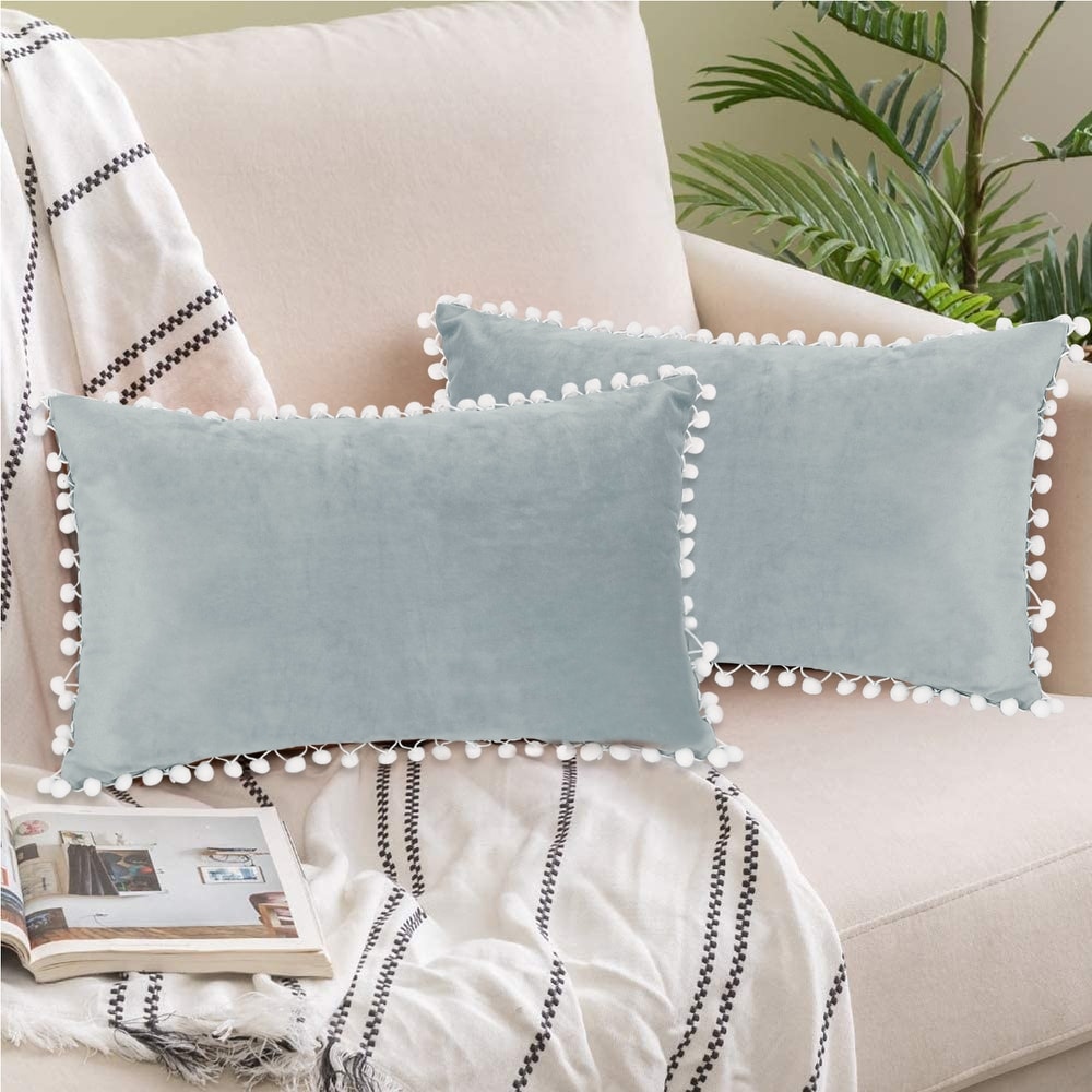 https://ak1.ostkcdn.com/images/products/is/images/direct/af572304f6e887b0411b5f1bd23f11701c2795cd/Adeco-Pack-of-2-Decorative-Throw-Pillow-Covers-with-Pom-Poms.jpg