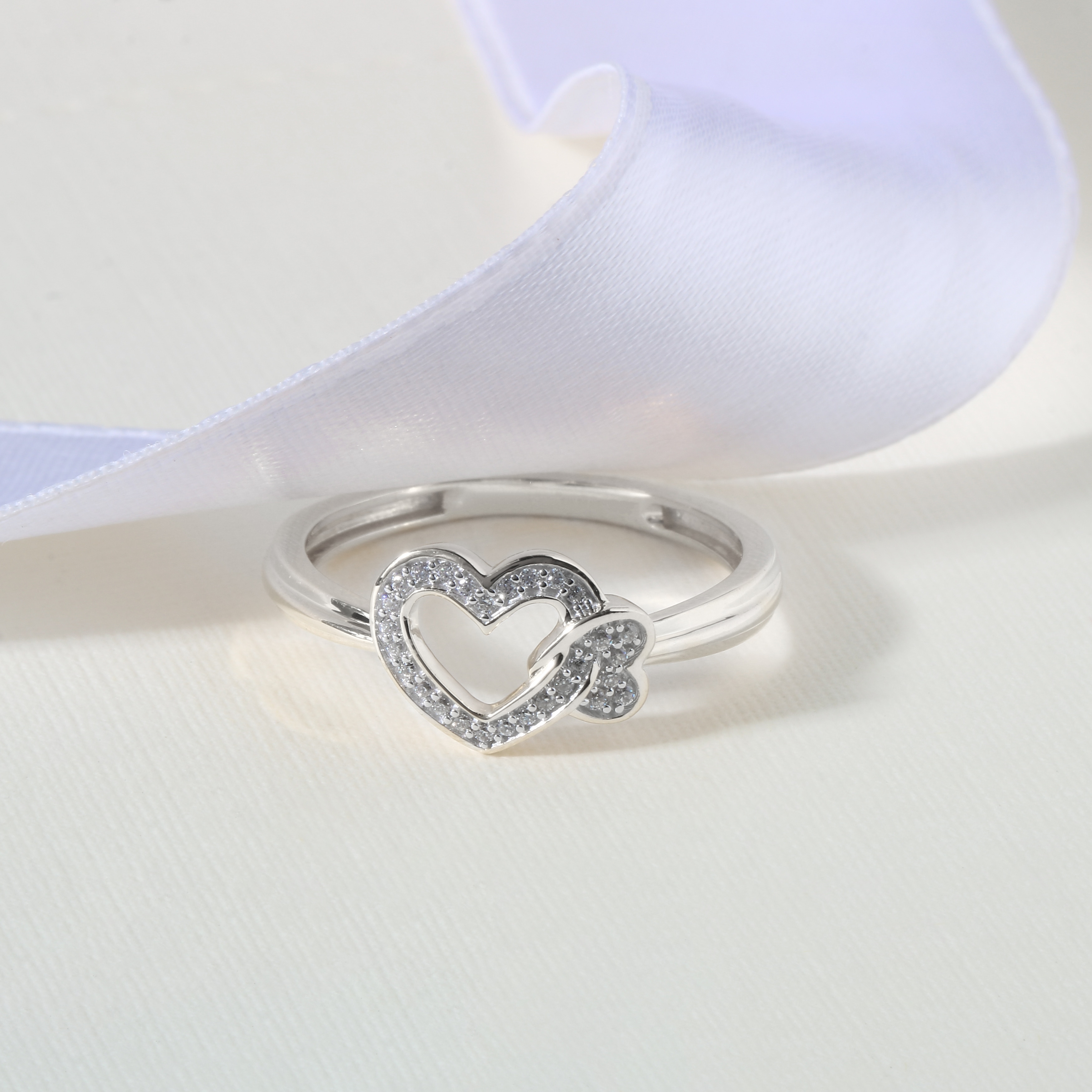 925 Silver hearts entwined ring size Q 1/2  Free Gift Bag
