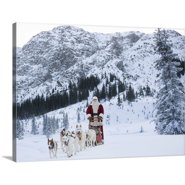 "A team of Husky dogs pulling Santa Claus and his sleigh" Canvas Wall Art