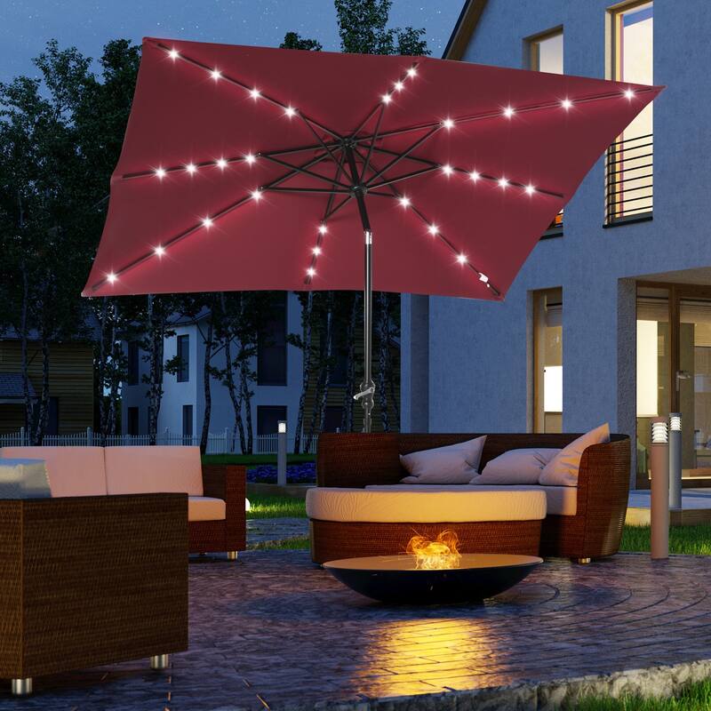 Outdoor terrace umbrella with tilting mechanism and LED lighting