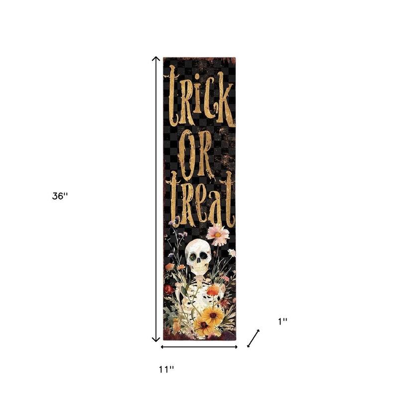 HomeRoots 36" Black And Gold Solid Wood Trick or Treat Halloween Skeleton Porch Sign