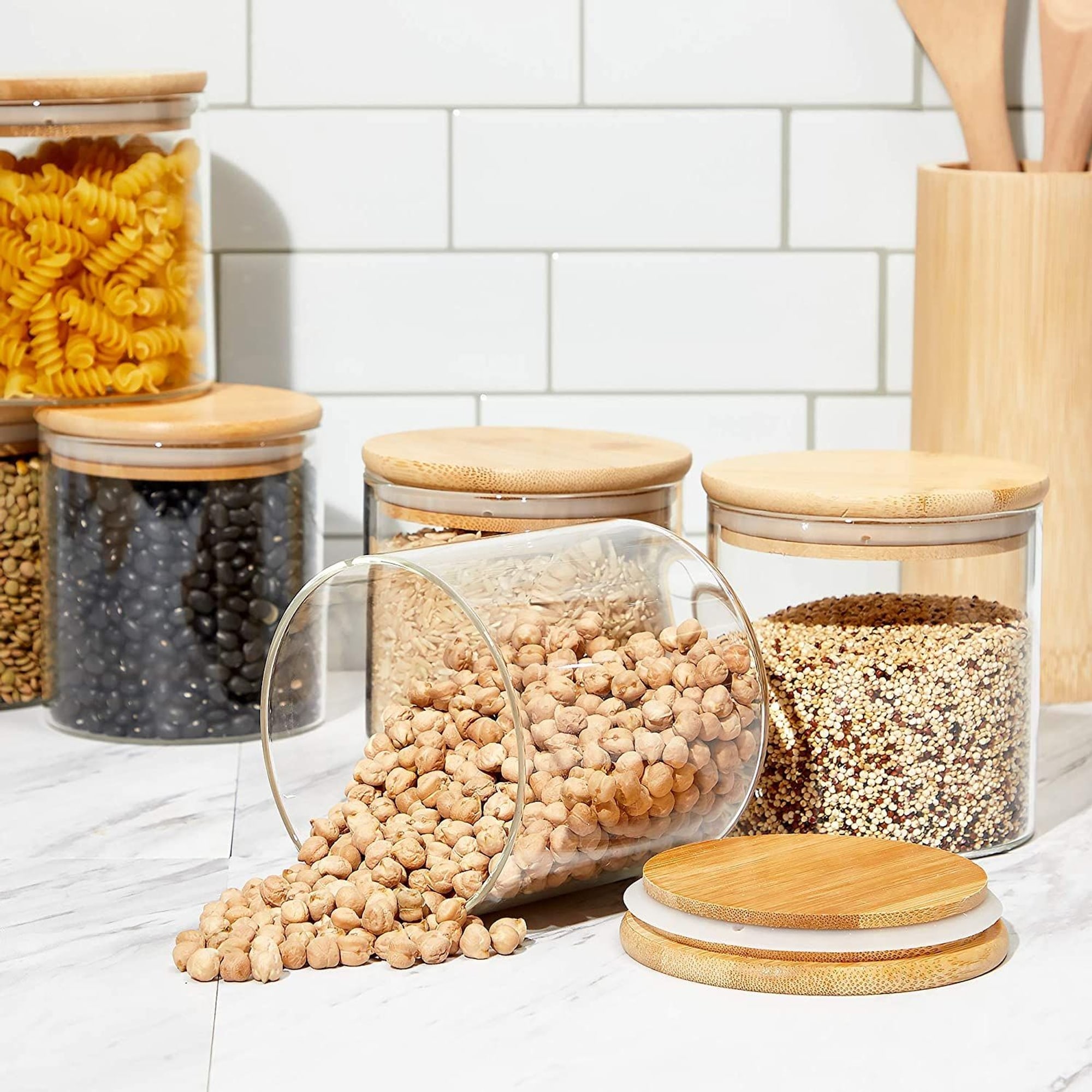 https://ak1.ostkcdn.com/images/products/is/images/direct/b1adb343fb87a1878fbae267f69a435f11264bc7/Glass-Canisters-with-Airtight-Bamboo-Lids-for-Pantry-Storage-%284-x-4.13-In%2C-5-Pack%29.jpg