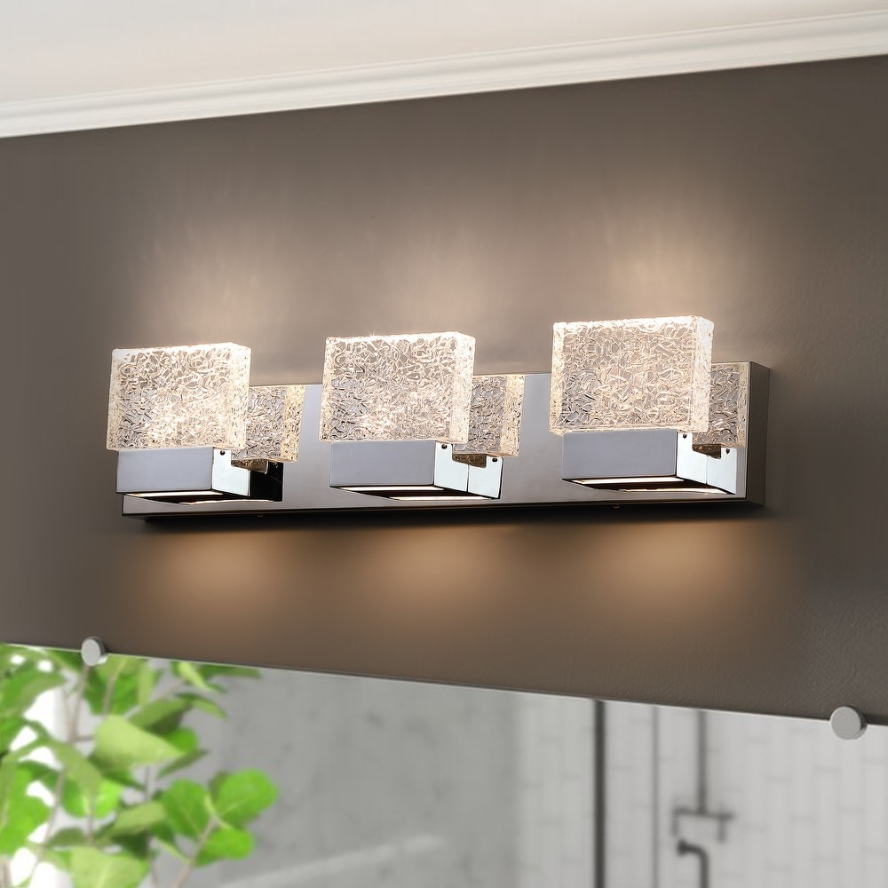https://ak1.ostkcdn.com/images/products/is/images/direct/b1c274ab0b3478ca53a3d7134cf05c069d45bee4/3-Light-4-Light-Brushed-Nickel-LED-Vanity-Light-with-Clear-Ice-like-Brick-Glass-Shades.jpg