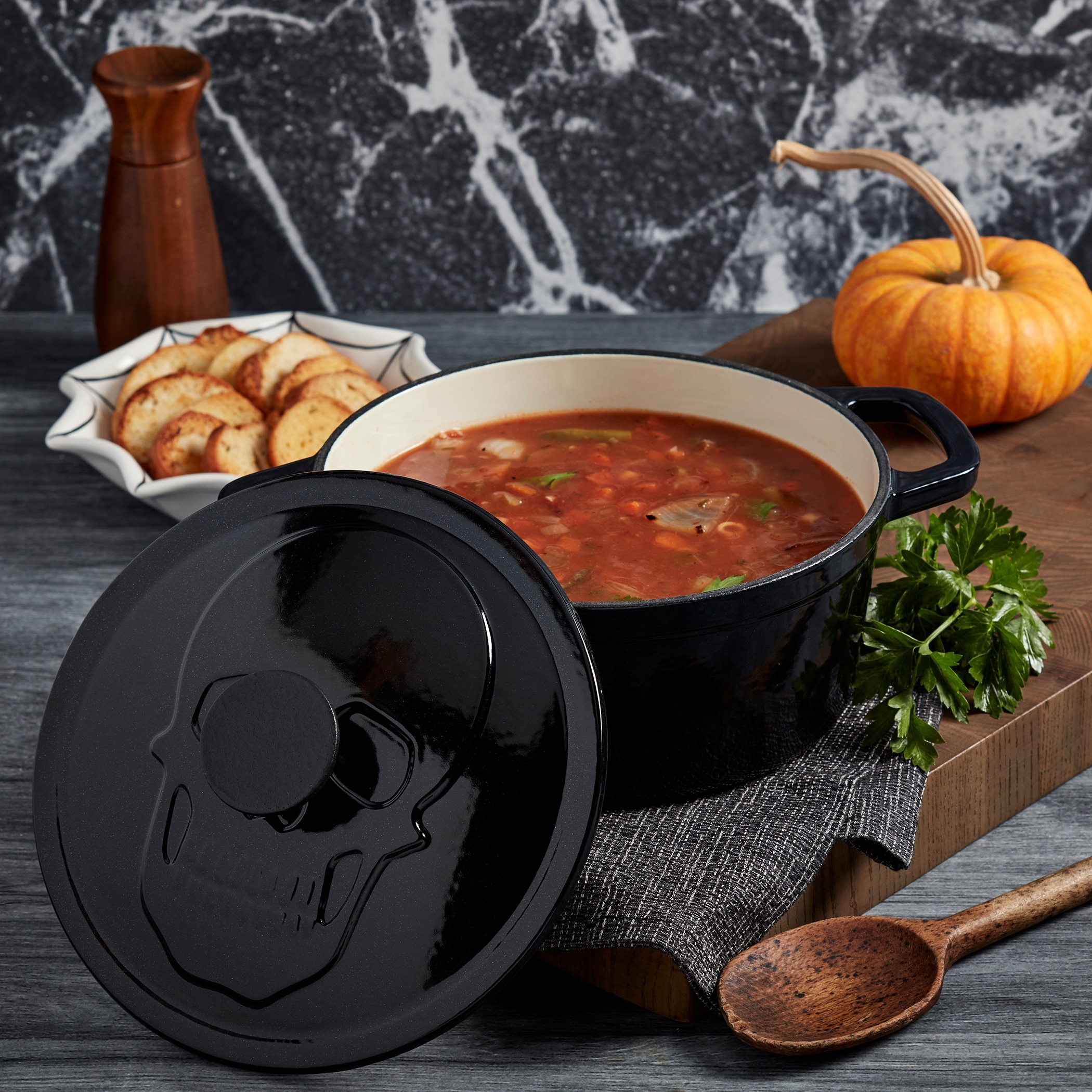 https://ak1.ostkcdn.com/images/products/is/images/direct/b219ada2e32850d3671569433c61e3d319c3db8f/3qt-Enamel-Cast-Iron-Covered-Cast-Iron-w--Skull-embossed-lid.jpg