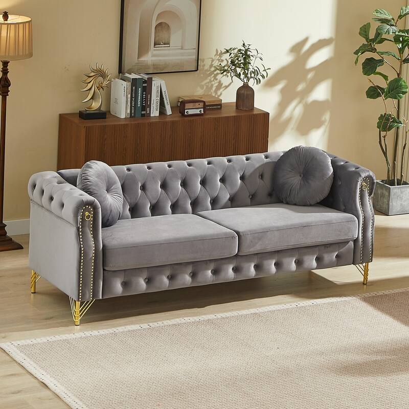 Chesterfield Sofa with Two Round Pillows, Featuring Copper Stud Detailing and Tufted Button Accents