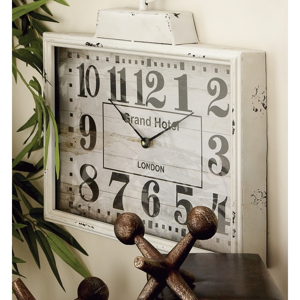 https://ak1.ostkcdn.com/images/products/is/images/direct/b2abd4195a017d0710056628ced53e59119bf813/White-Iron-Vintage-Wall-Clock-No-Theme-15-x-16-x-2.jpg