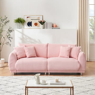 86.6 inch teddy fleece pink sofa with four throw pillows and hardware feet can sit comfortably in an apartment bedroom