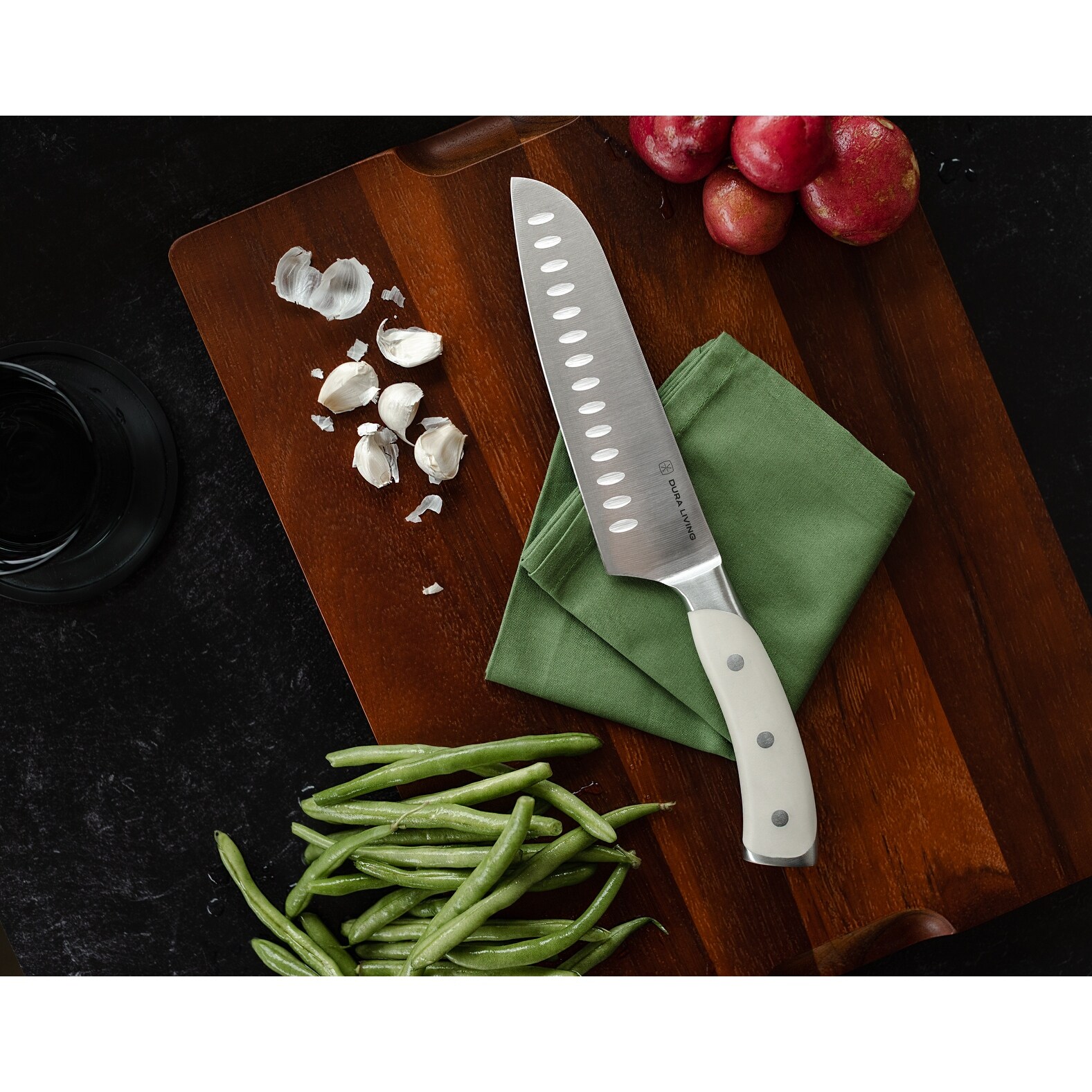 https://ak1.ostkcdn.com/images/products/is/images/direct/b356486fcbaff26eb1bc5a35dc2d03f1dc3f860e/Dura-Living-Elite-7-inch-Santoku-Knife---Forged-High-Carbon-German-Stainless-Steel-Blade%2C-Black.jpg