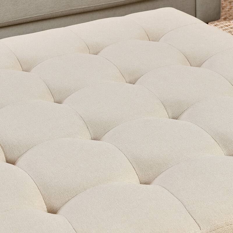 Coffee table with tufted linen upholstery