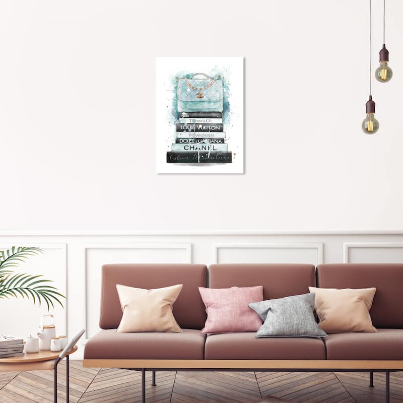 Wynwood Studio Canvas Fashion and Glam Splash Top On Books Blue Blue and Light Blue Glam Wall Art Canvas Print - 30 x 20