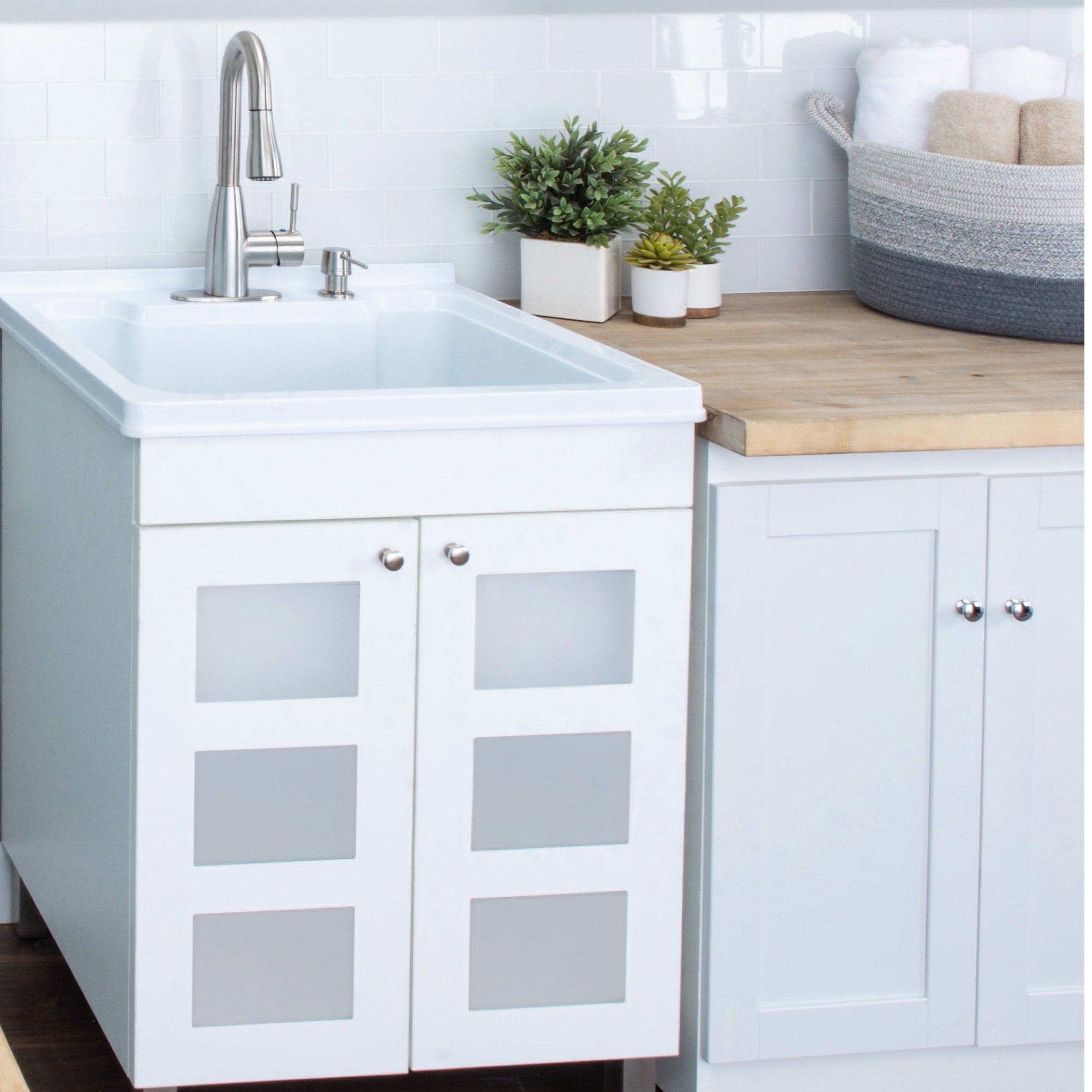 Utility sink deals with cabinet