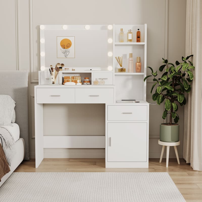 The vanity with a mirror is equipped with a hair dryer rack