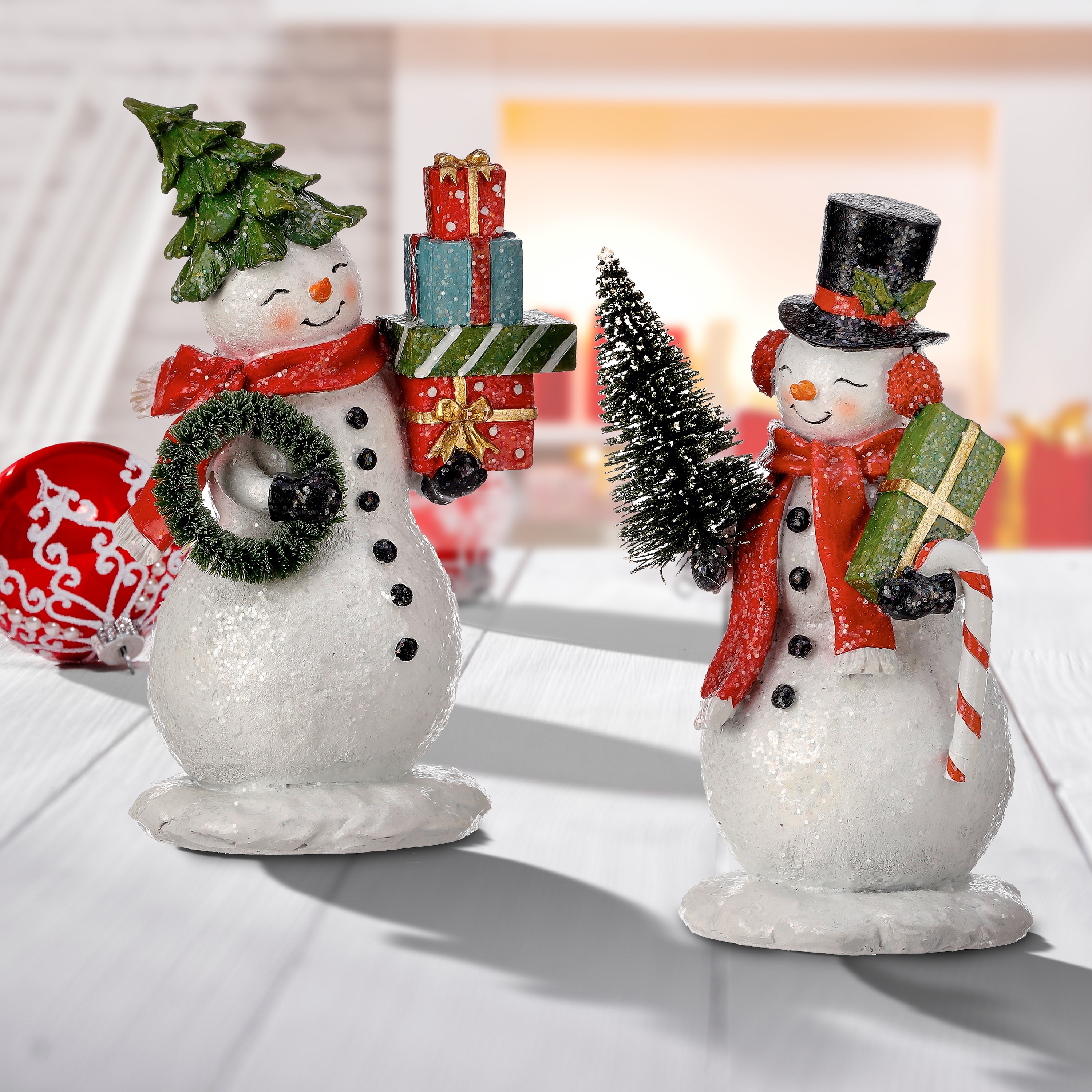https://ak1.ostkcdn.com/images/products/is/images/direct/b4ecdab03a0844b9ad719b4b28daeb23afc7b6c8/8%22-Resin-Snowman-With-Packages-Set-of-2.jpg