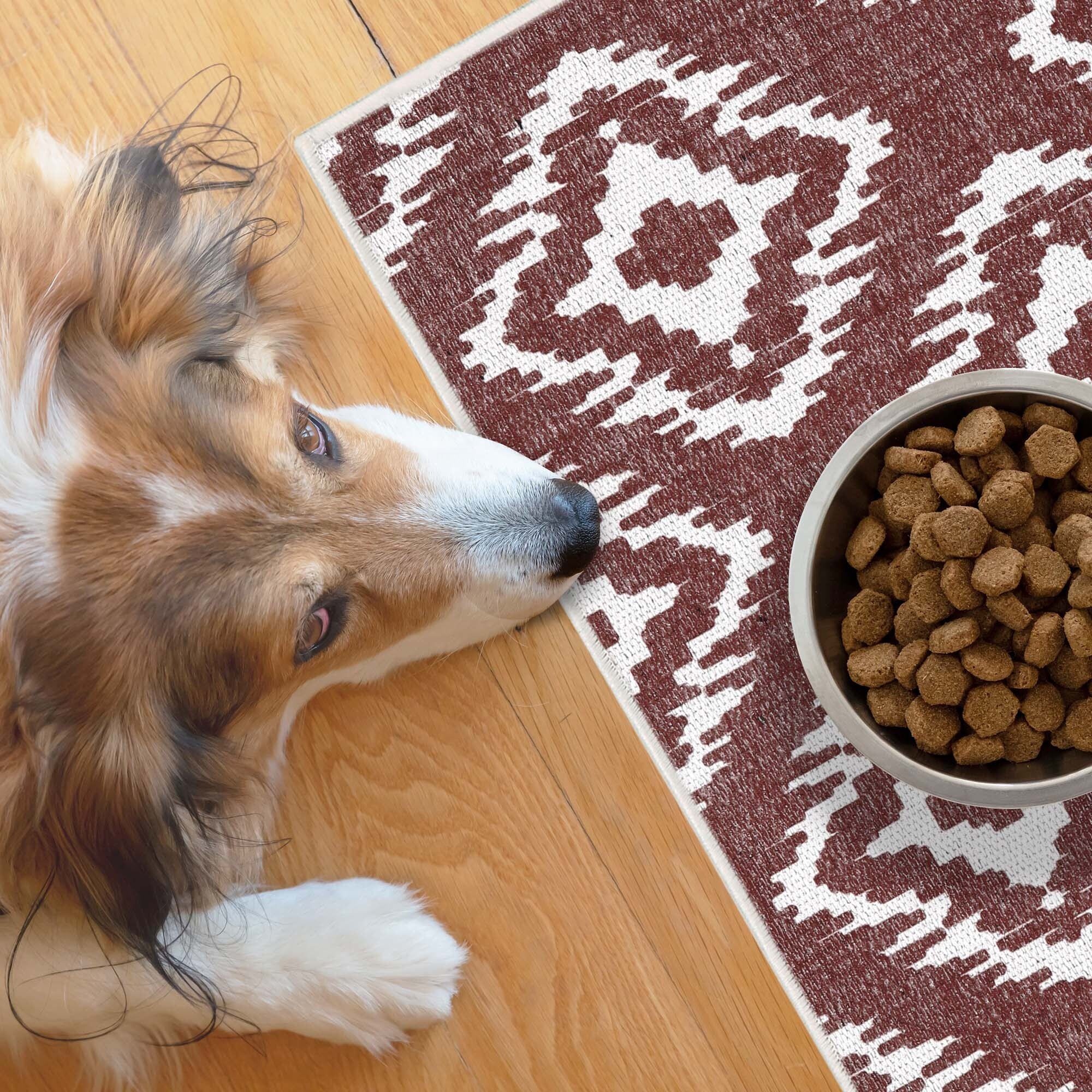 dog eating mat
