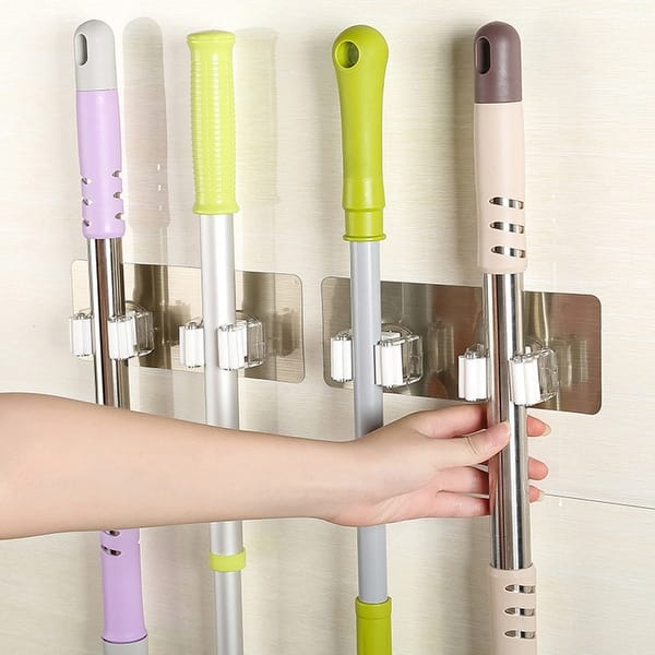 https://ak1.ostkcdn.com/images/products/is/images/direct/b57139659d9ec86e0baf3593c8f89a64ab199702/Wall-Mounted-Mop-Organizer-Holder-Brush-Broom-Hanger-Storage-Rack-Kitchen-Tool.jpg?impolicy=medium