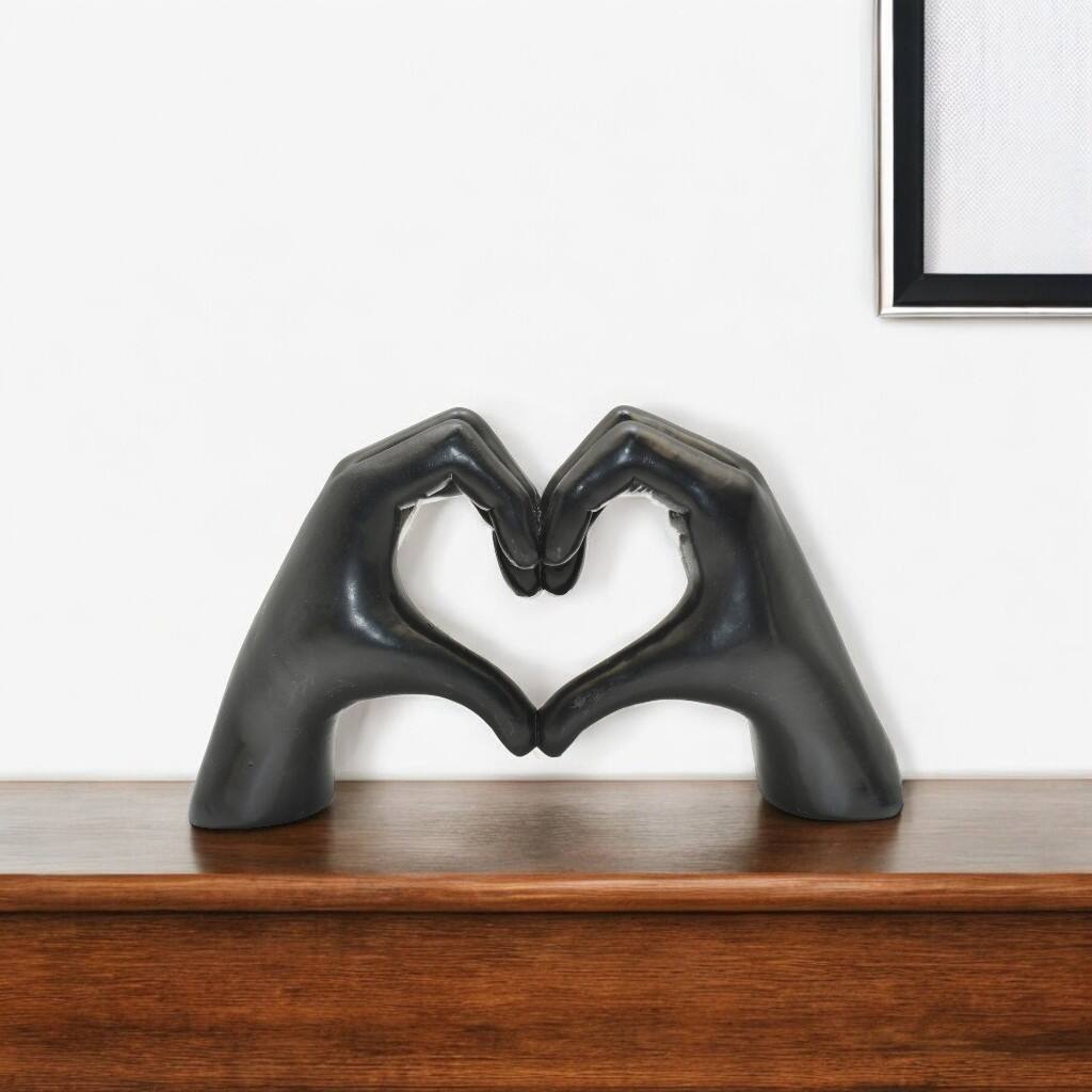 HomeRoots 4" Black Resin Heart Hands Tabletop Sculpture - 5.5 in. x 3.5 in. x 1.5 in.
