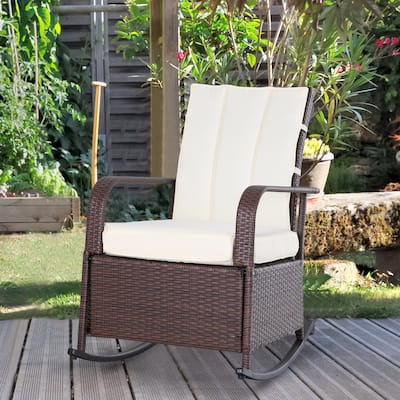 Brown Rattan Outdoor Rocking Recliner Chair with White Cushions Adjustable Footrest and Weather Resistant PE Wicker