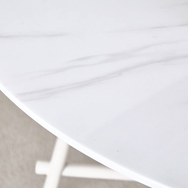 A Modern Minimalist Circular Dining Table With A 42 Inch Diameter White Patterned Tabletop And White Metal Legs