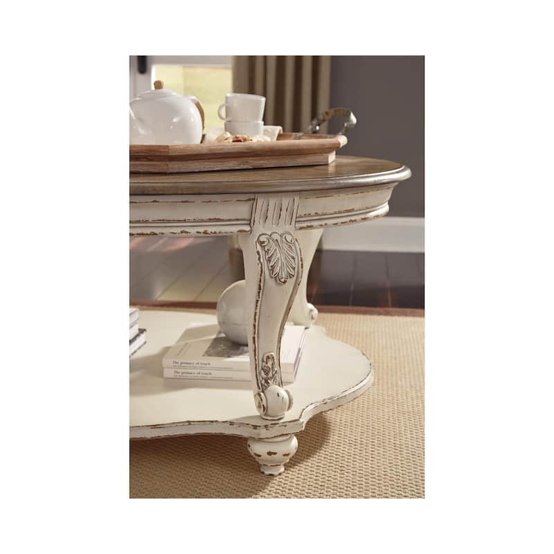 Signature Design by Ashley Realyn Oval Cocktail Table - 48.13" W x 34" D x 19.88" H