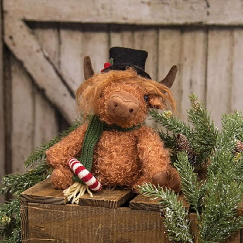 Christmas Sitting Highland Cow with Candy Cane Accent - 6” x 4” x 10.25”
