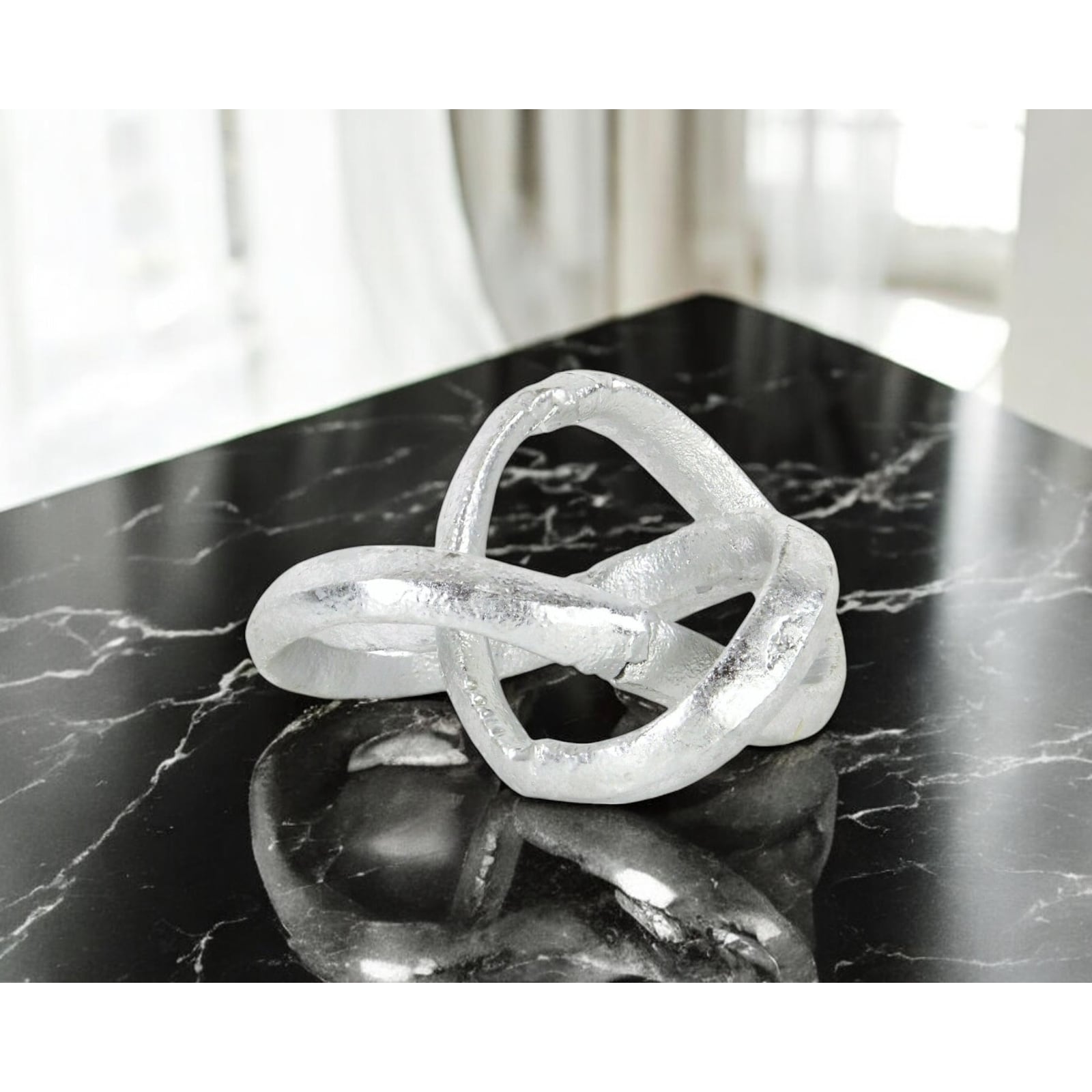 HomeRoots 6" Silver Cast Iron Modern Abstract Infinity Knot Tabletop Sculpture - 5.75 in. x 3.25 in. x 5.25 in.