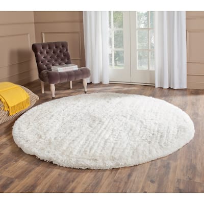 SAFAVIEH Handmade South Beach Leonella Shag Solid Polyester Rug