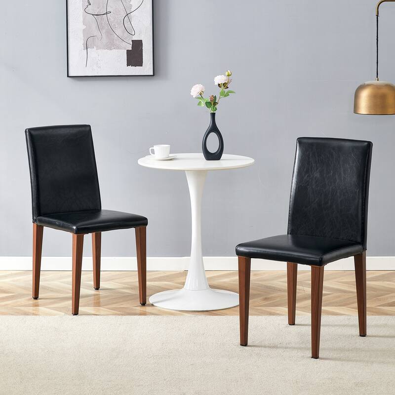 Two black PU dining chairs, simple and versatile, comfortable and accompanied. The exquisite and multifunctional dining