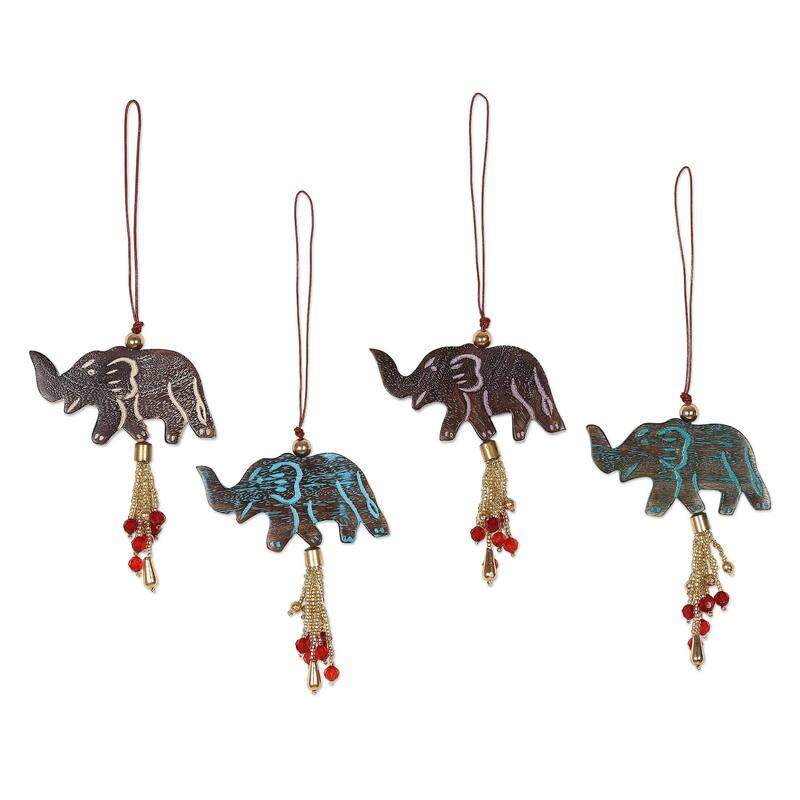 NOVICA Elephant Celebration, Wood ornaments (set of 4) - Each: 1.8" H x 3" W x 0.3" D