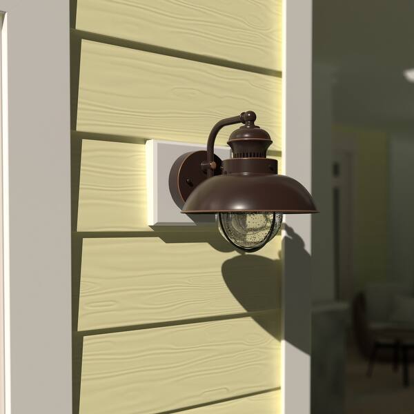 slide 2 of 8, VAXCEL Harwich 8 in. H 1-Light Burnished Bronze Coastal Outdoor Wall Sconce, Steel, Clear Seeded Glass Shade Burnished Bronze - 8-in W x 8-in H x 9.25-in D