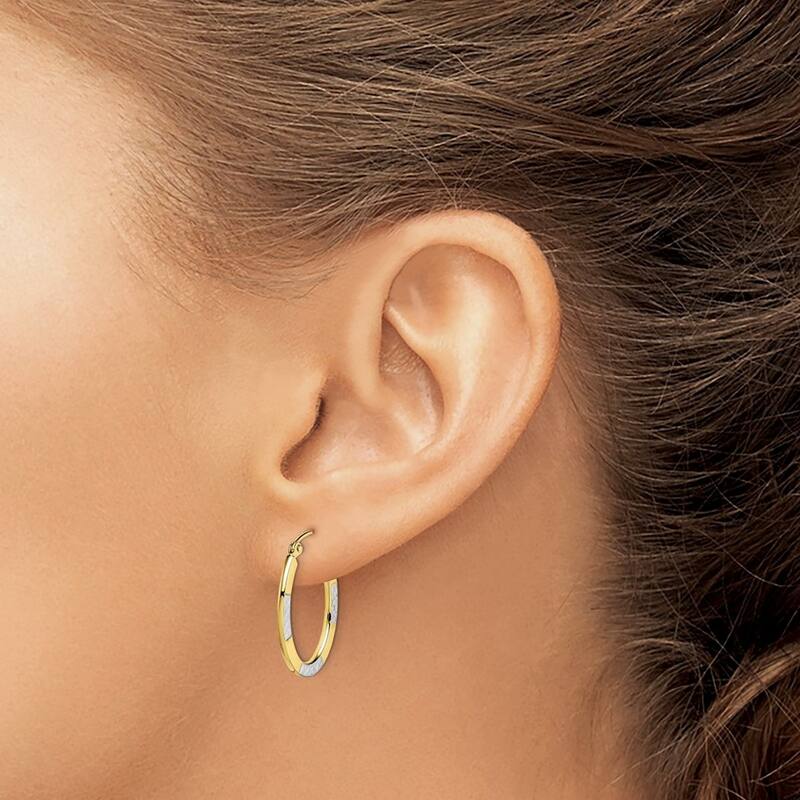 Curata 10k Yellow Gold and Rhodium Sparkle Cut Oval Hoop Earrings 23x1.5mm
