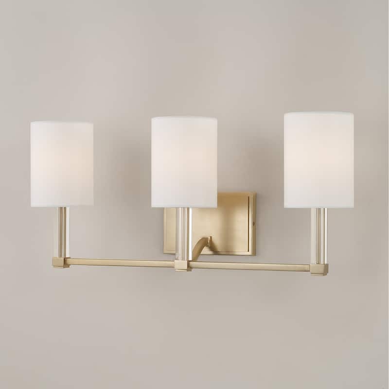 24" W x 9.75" H 3-Light Vanity in Matte Brass with Clear Acrylic Accents and Cylindrical White Fabric Shades