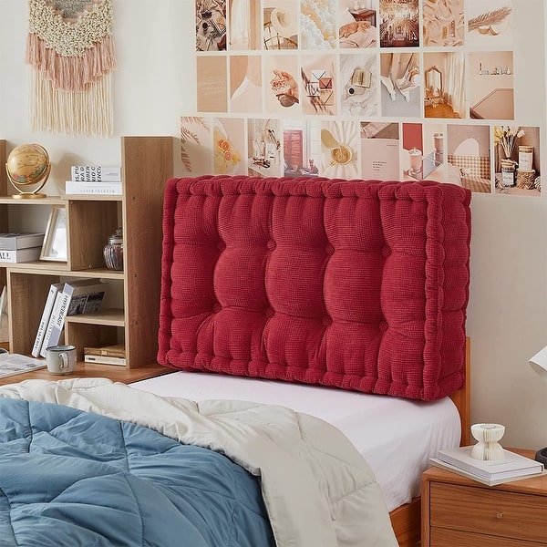 thick upholstered headboard blocking cold draft from bedroom wall