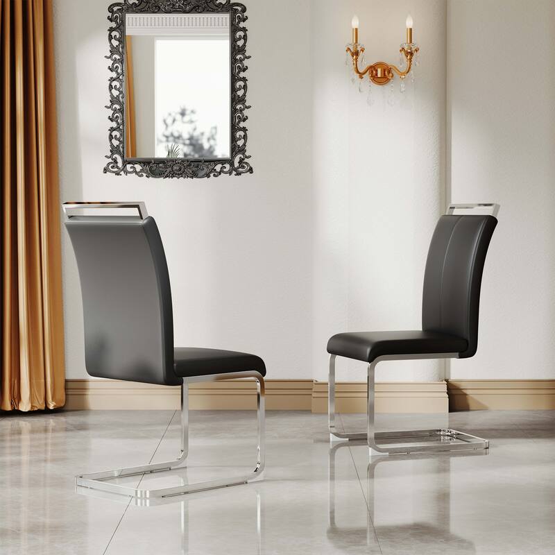 A set of 4 artificial leather dining chairs