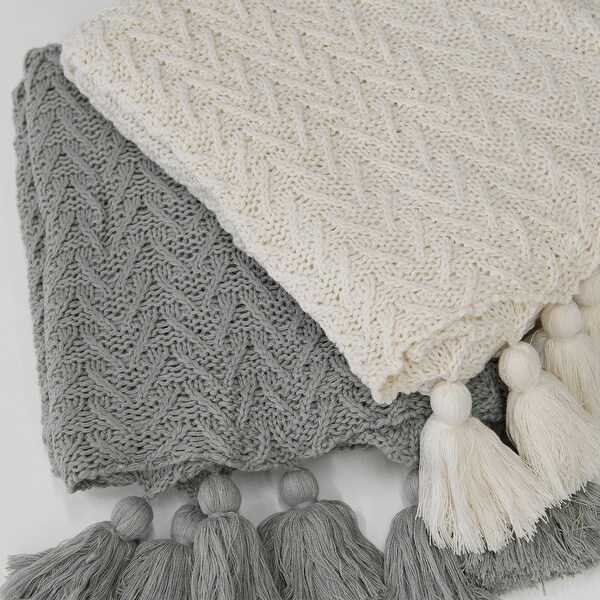 Knitted blanket with hotsell tassels