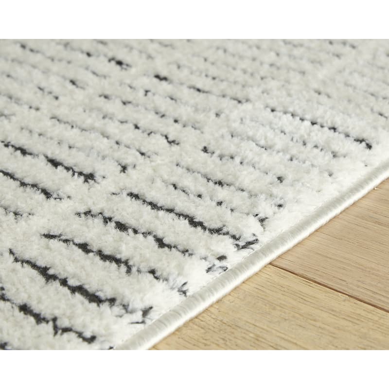 Signature Design by Ashley Turinwith Beige/Black Area Rug