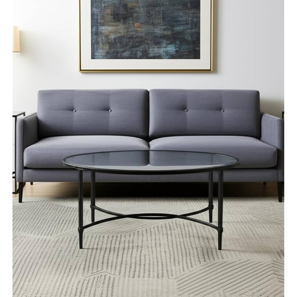 HomeRoots 45" Clear and Black Glass and Metal Oval Coffee Table - 19" H x 45" W x 25" D