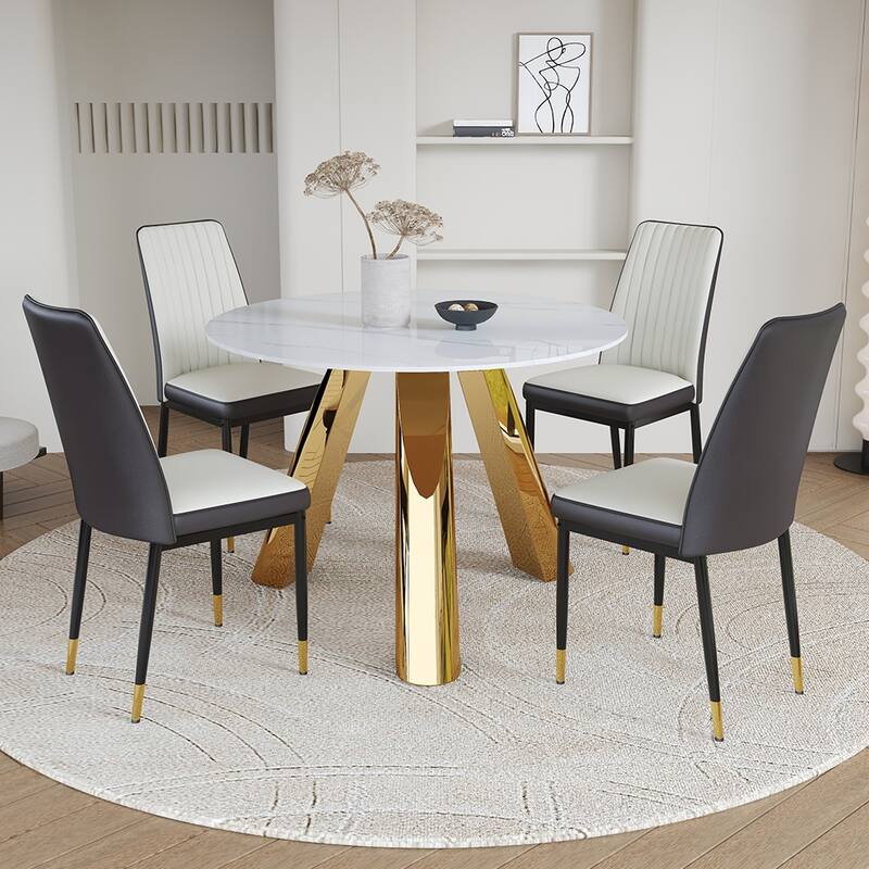 A 42-inch round dining table with cast iron base and stainless steel legs, paired with four white-gray striped dining ch