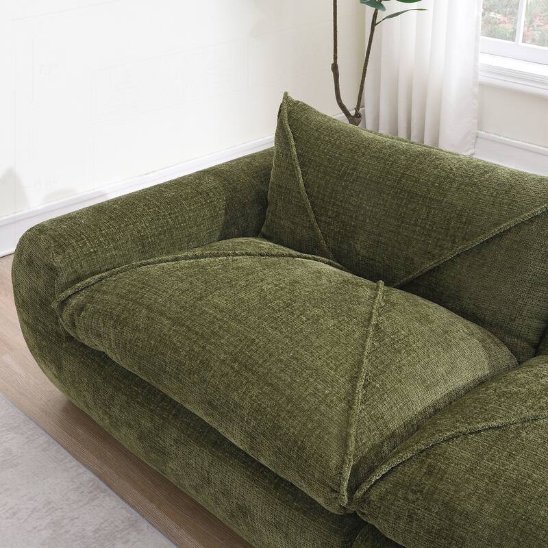 Versatile Compressed Sofa with Integrated Cushions and Movable Ottoman