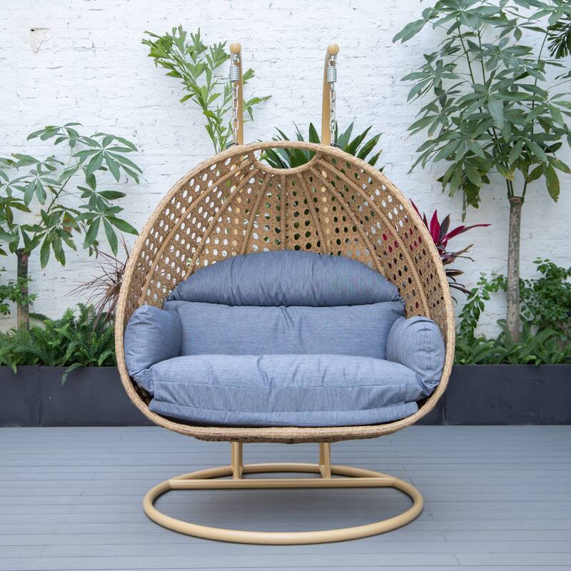 LeisureMod Mendoza 2-Person Hanging Egg Swing Chair - Handcrafted Light Brown Wicker, Patio Hammock Lounger with Cushions - 53"