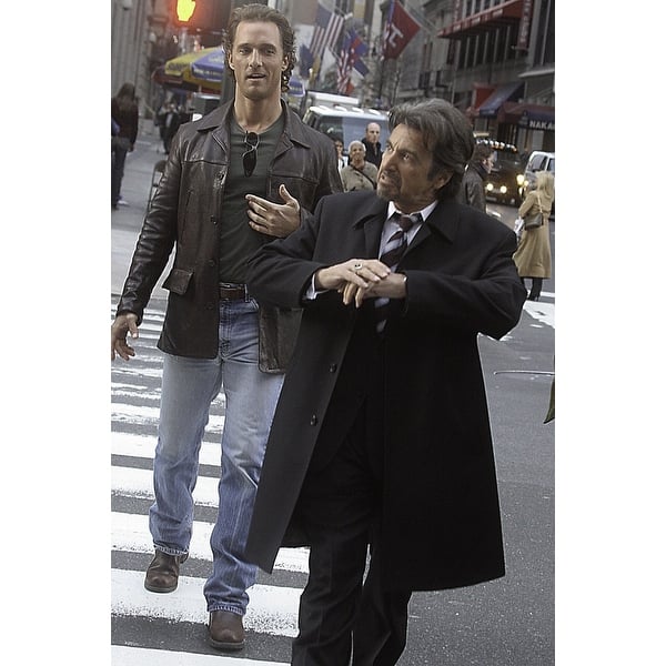 A film still of Al Pacino and Matthew McConaughey walking across a