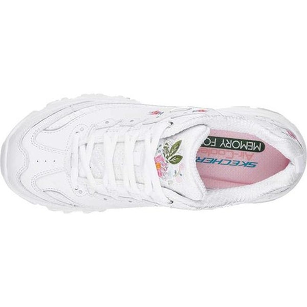 white tennis shoes with flowers