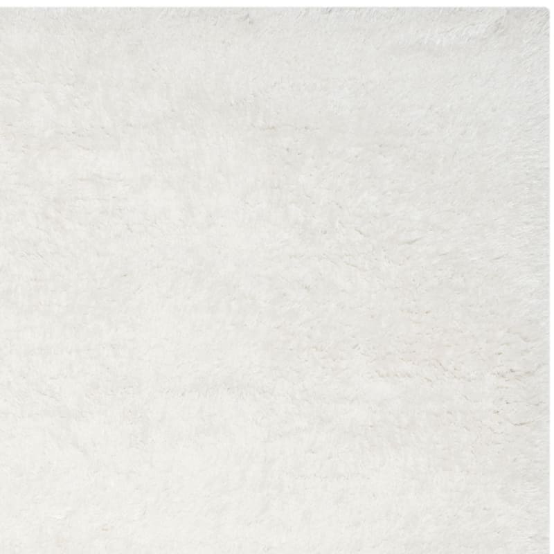 SAFAVIEH Handmade South Beach Leonella Shag Solid Polyester Rug