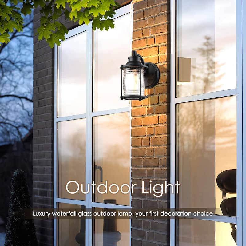 1-light outdoor wall light with black finish and seeded glass shade