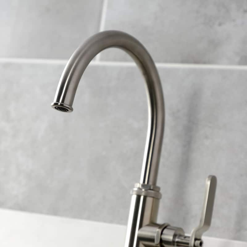 Kingston Brass Whitaker Single-Handle Deck Mount Kitchen Faucet with Brass Sprayer