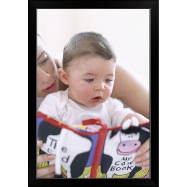 "Mother reading to baby boy" Black Framed Print
