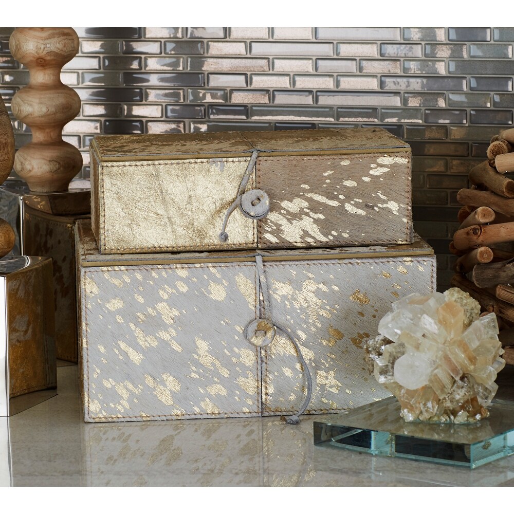 https://ak1.ostkcdn.com/images/products/is/images/direct/bb900fb5fe481cc8c7d969c4f7dee57a14eba209/Benzara-White-and-Gold-Wood-and-Leather-Decorative-Boxes-%28Set-of-2%29.jpg