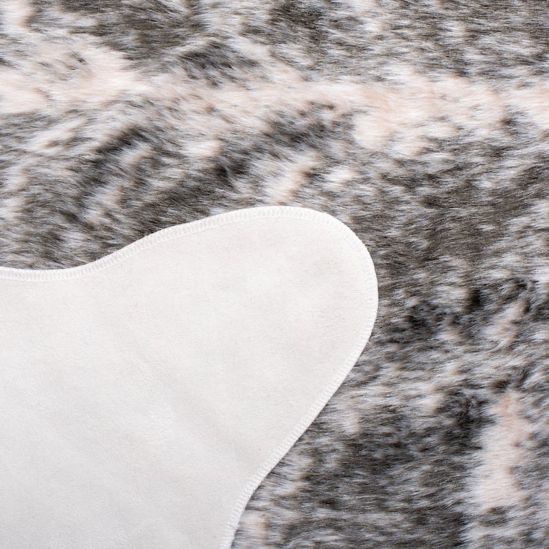 SAFAVIEH Faux Cow Hide Sinne Animal Rug