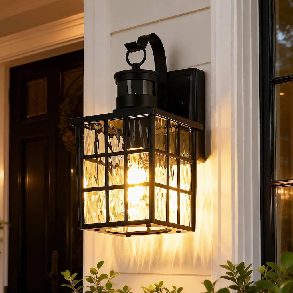 12 in. Matte Black 1-Light Motion Sensing Outdoor Wall Sconce with Dusk to Dawn and Water Wave Glass Shade