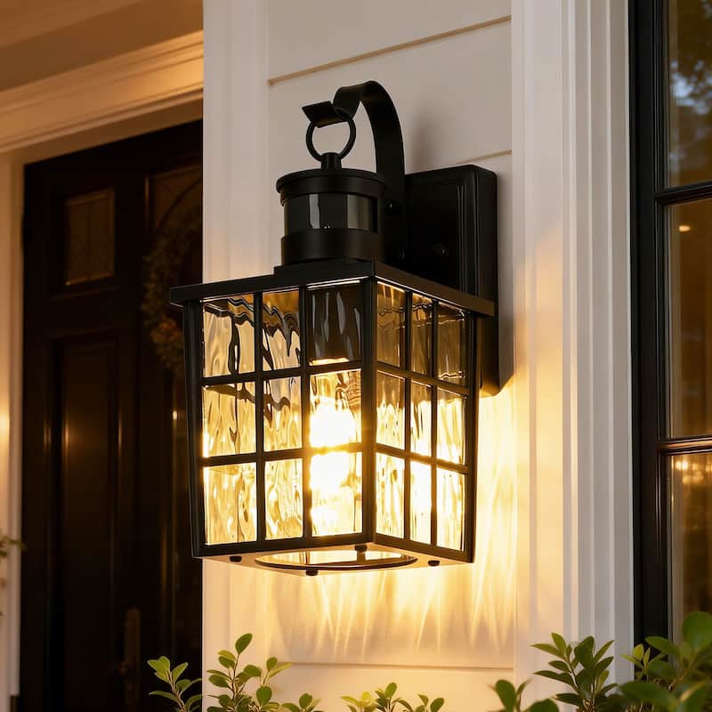 12 in. Matte Black 1-Light Motion Sensing Outdoor Wall Sconce with Dusk to Dawn and Water Wave Glass Shade - Black